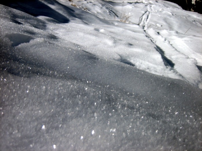 Surface hoar and near surface facets growing on shaded slopes.